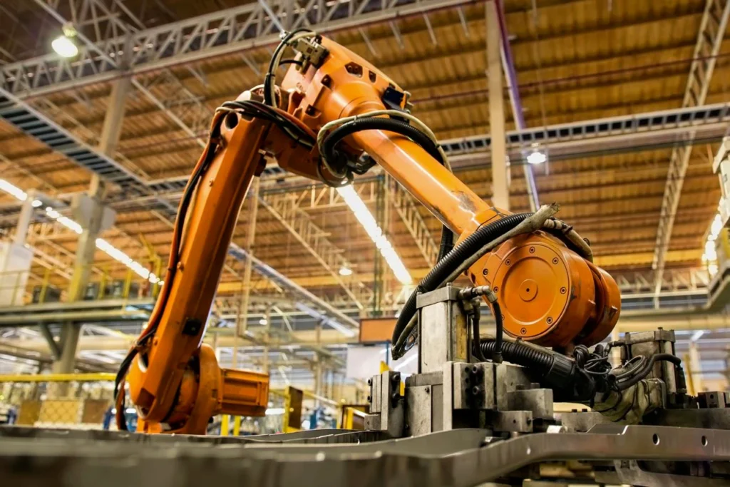Industrial robotic arm performing automated manufacturing operations in a modern factory