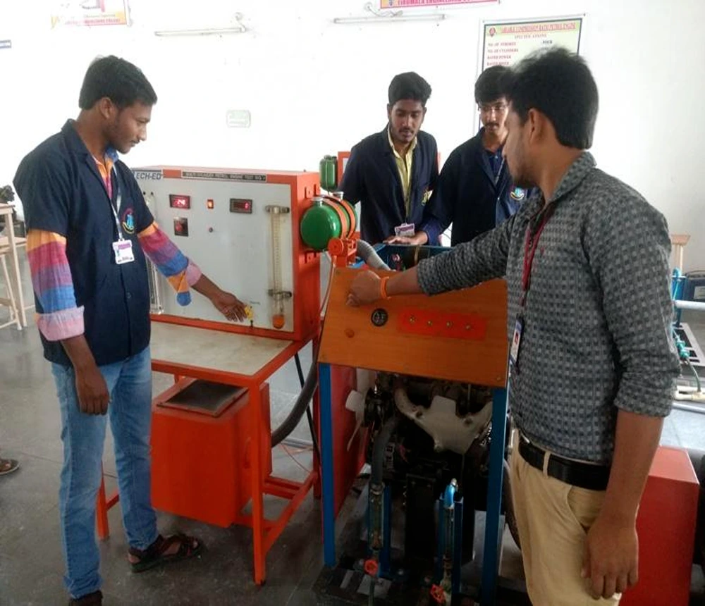 Mechanical engineering students conducting a thermodynamics experiment in an engineering laboratory